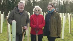 Cllr Wood surrounded by newly planted trees at Silverhill Farm with Cat Howourth and Iaian Stafford