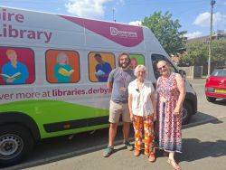 Rob Davenport, Cllr Wood and Ruth Sharpe standing by a mobile library van