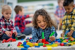 Child playing with building blocks