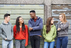 young people in front of garages