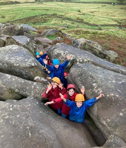 Children scrambling on rocks