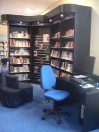 computer desk and shelves in a library