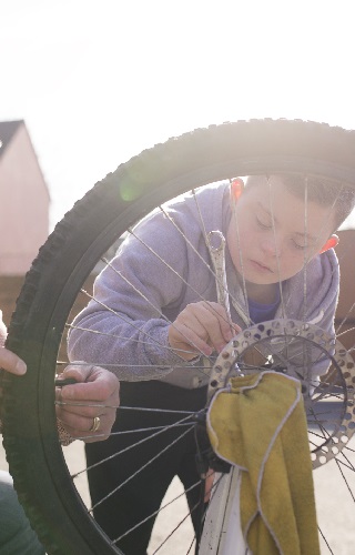 Dad and son fixing a bike