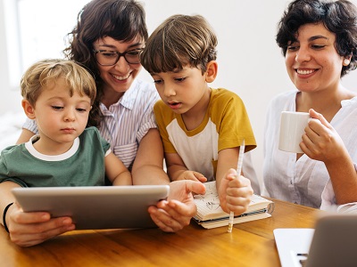 Family looking at a tablet together