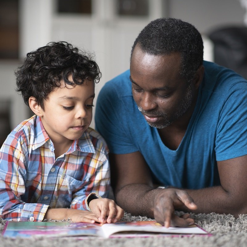 Father and son reading