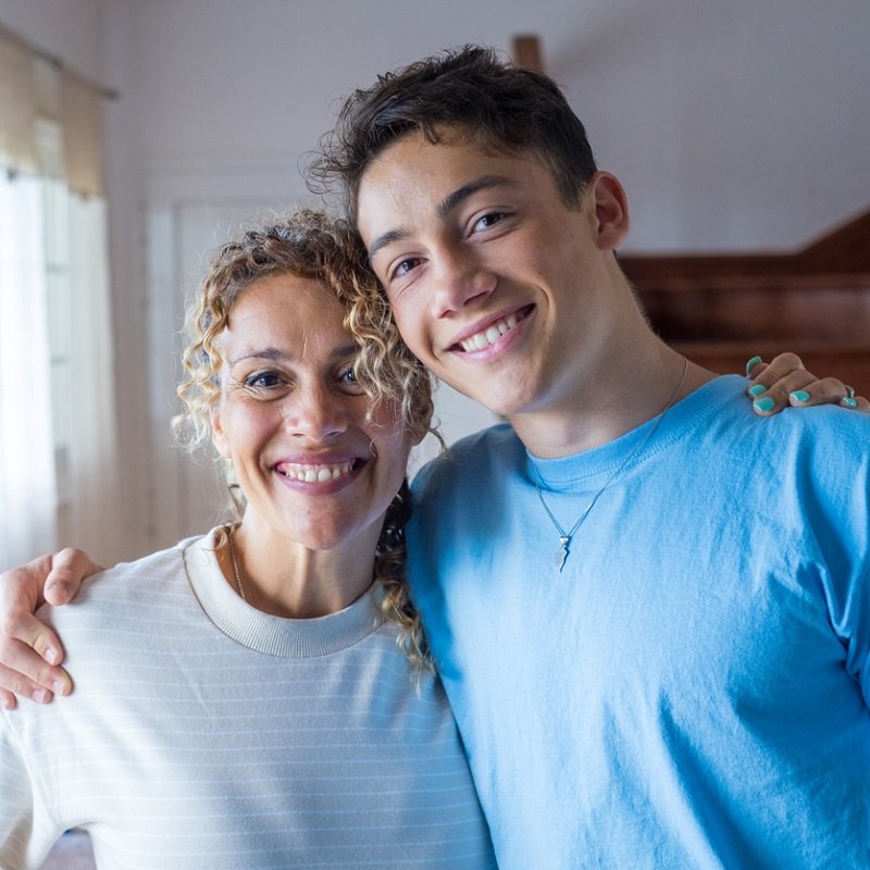 Mother and son smiling